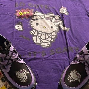 Worn 2x’s Purple Hello Kitty Halloween Mummy T-Shirt. 100% Cotton.